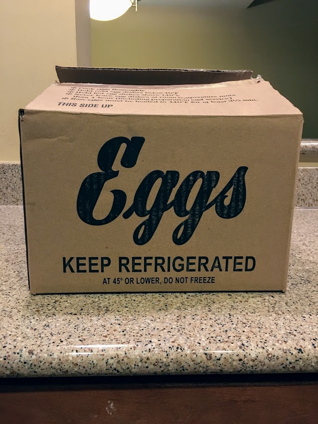 cardboard box with Eggs written in large text on the side