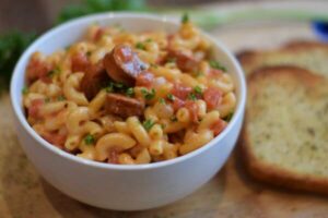 macaroni pasta with turkey sausage and parsley sprinkles