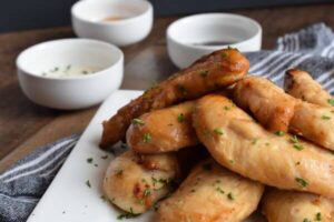 air fryer naked chicken tenders on a white plate